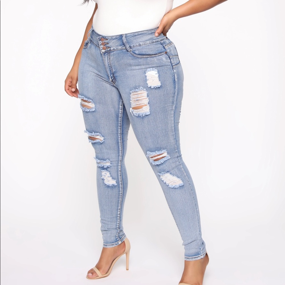 Distressed booty lifting mid rise jeans